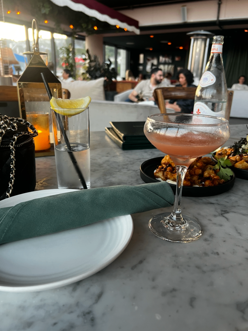 Client meetings and business strategy above the city, after the day's assignments have wrapped.