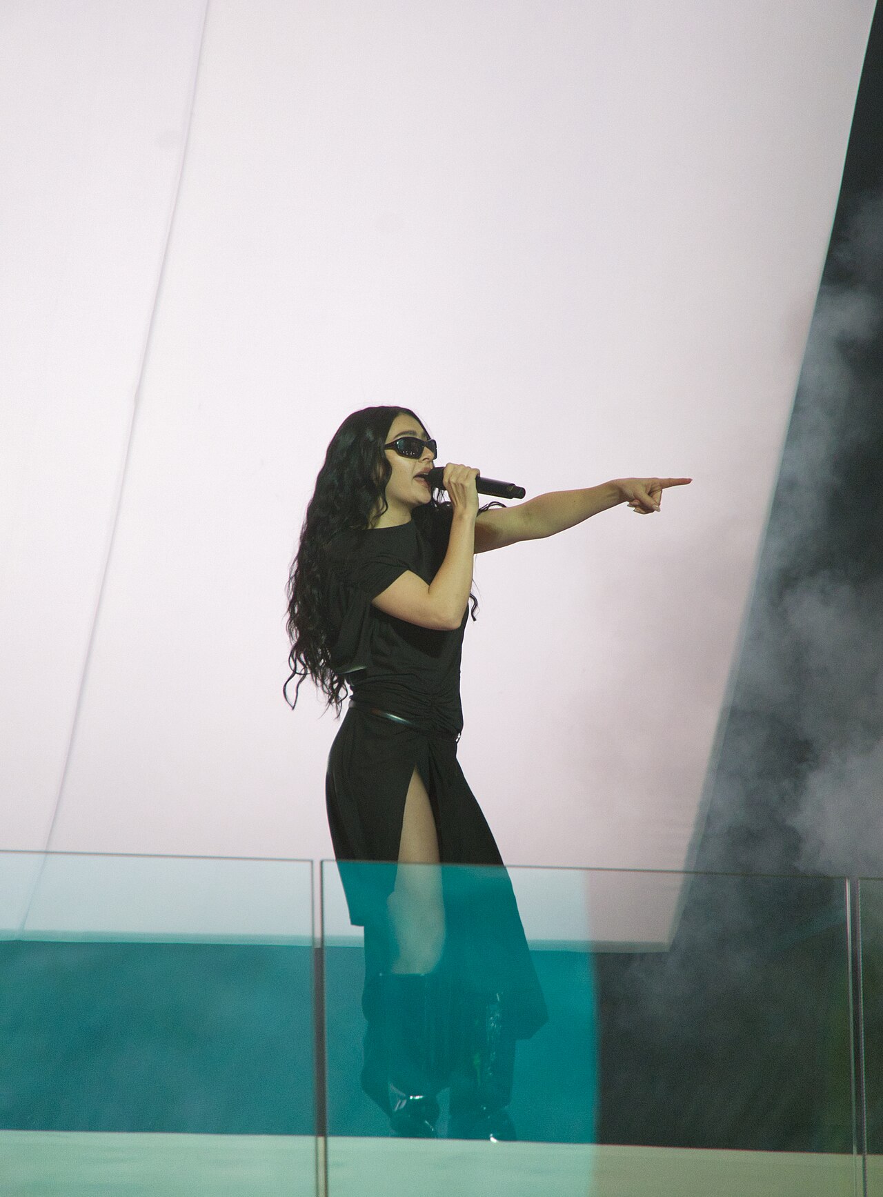 Charli XCX performing on stage in Times Square, New York, November 18, 2024