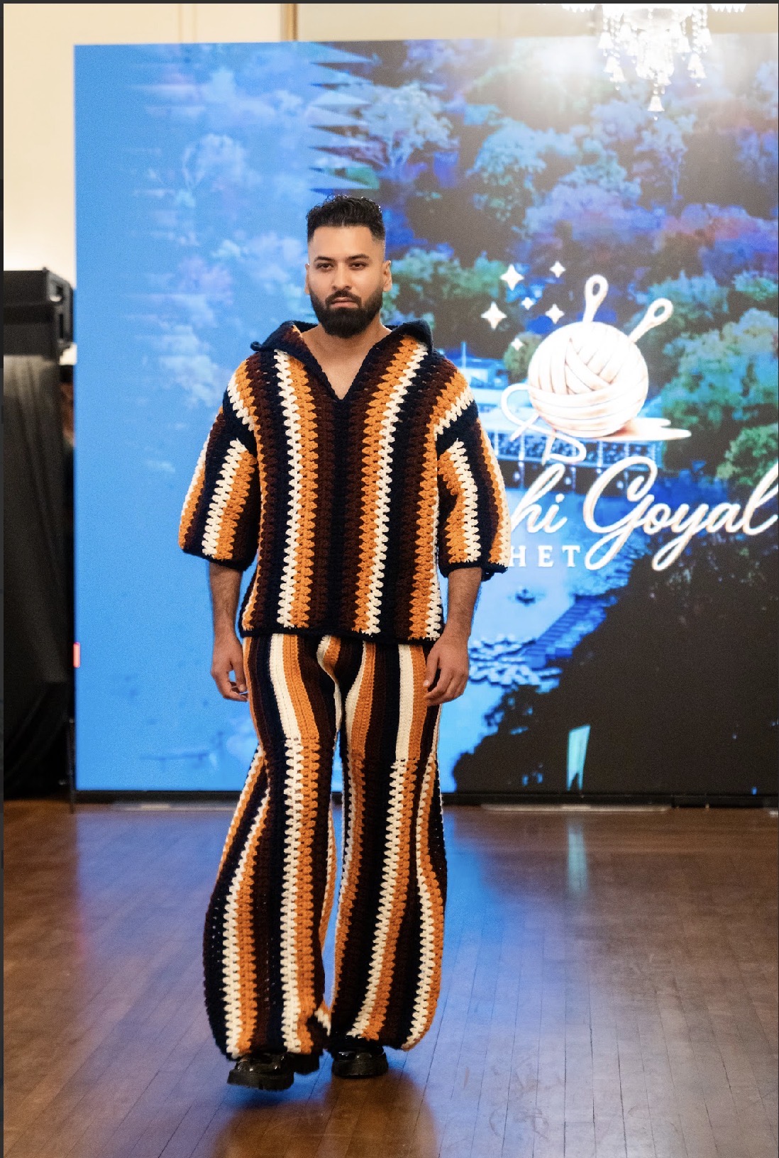 Model Arjun Pandey in a striped crochet two-piece look on the Season 05 runway
