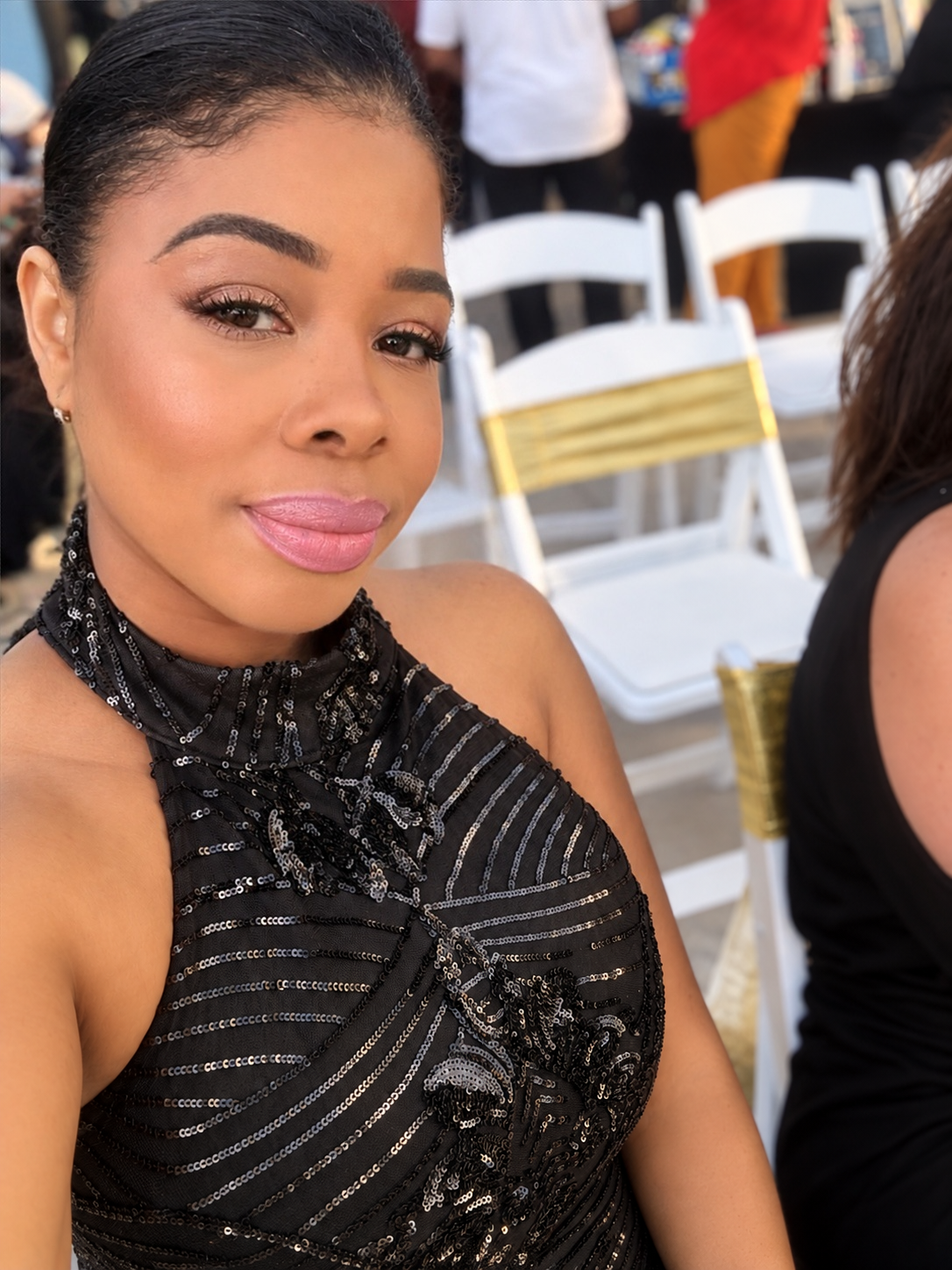 Guest in an embellished black gown at A Designer's Dream during New York Fashion Week.