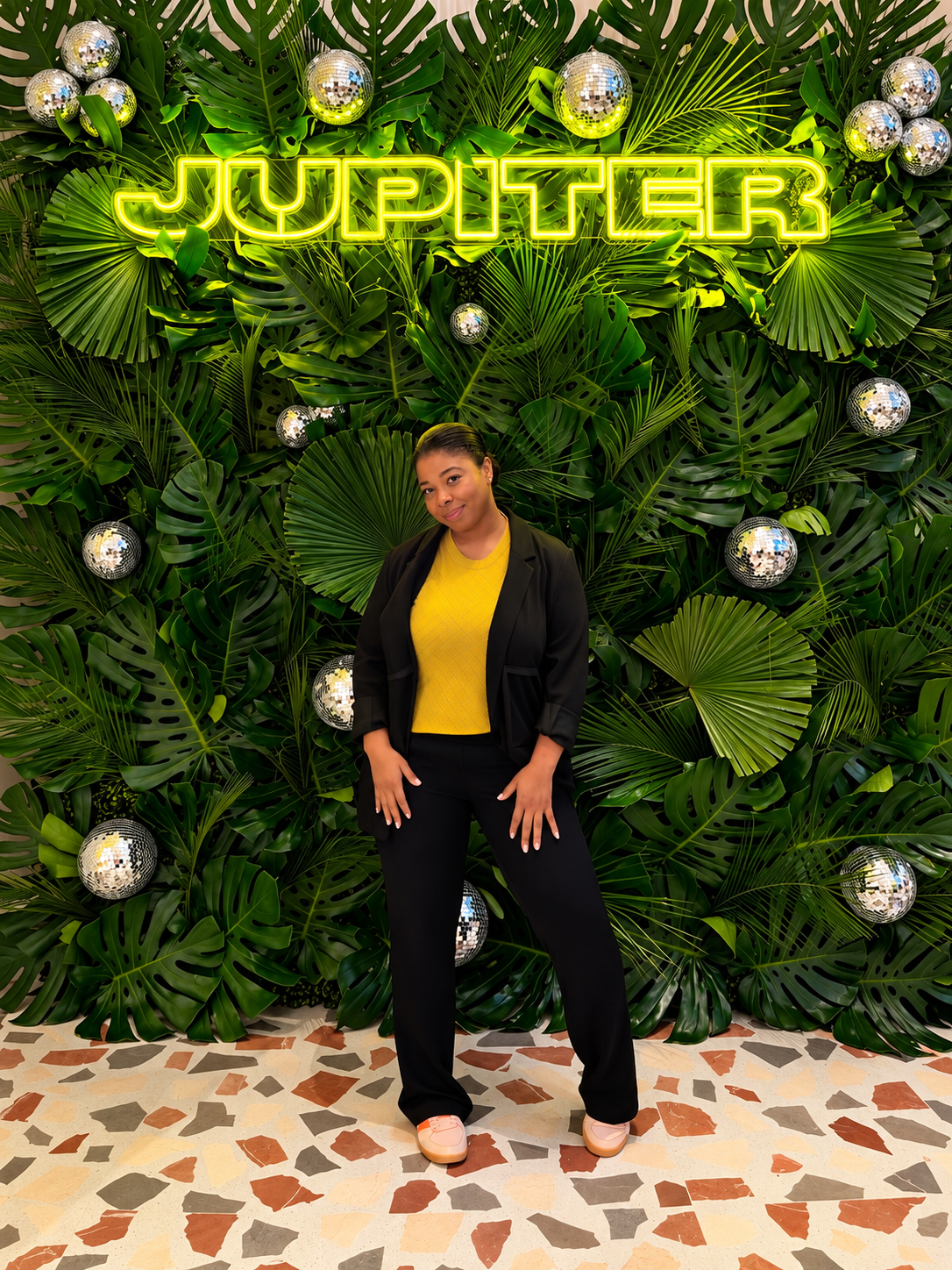 Robyn Antonius in front of the Jupiter green foliage wall