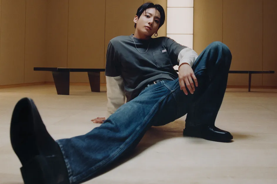 Jung Kook reclining in official Calvin Klein Fall 2026 denim campaign imagery.