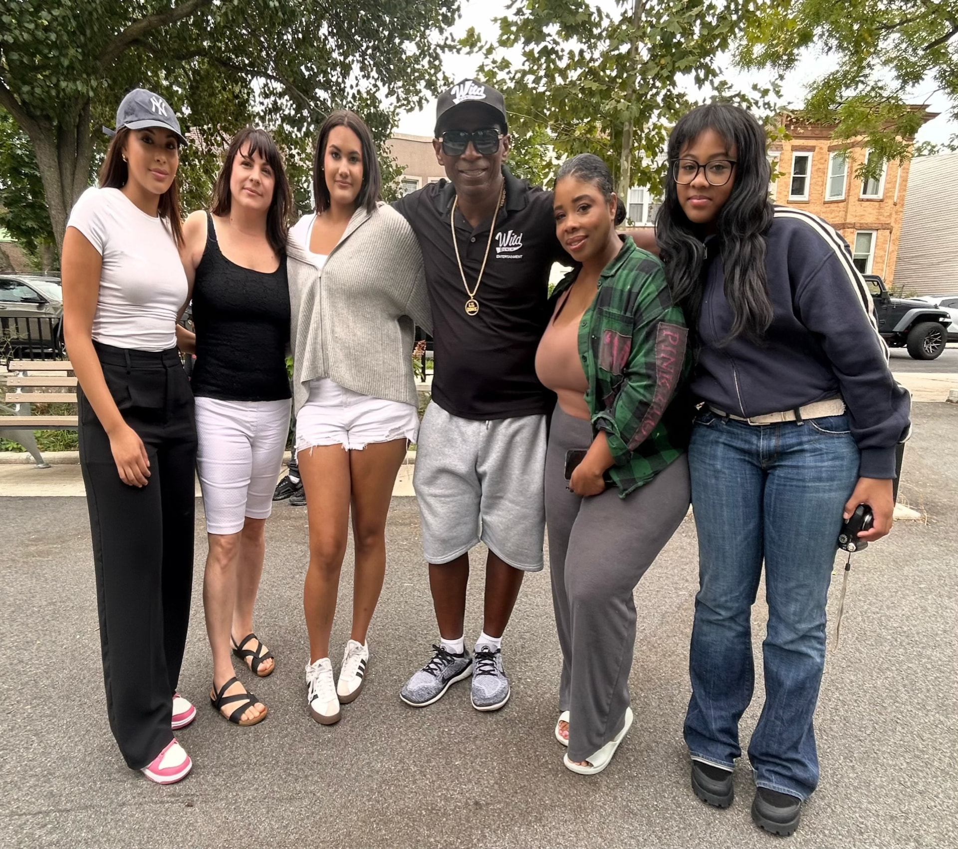 Urban Global Entertainment & Media representatives with Donny Smallwood Jr. at the Wild Bunch 7th Annual Community Event
